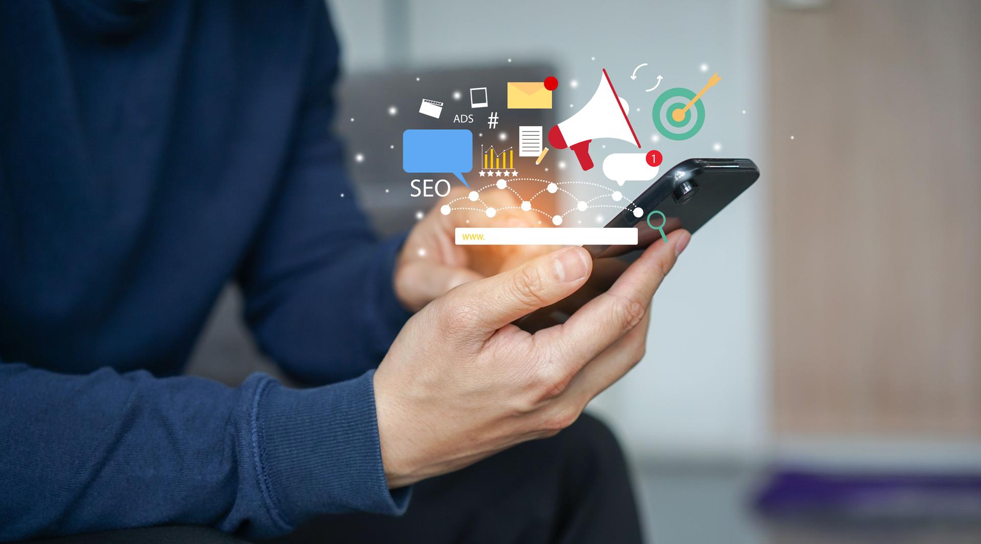 close up young man hand hold smartphone and use application of e-commerce to working about social media marketing tools for business and technology concept